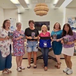 women holding books