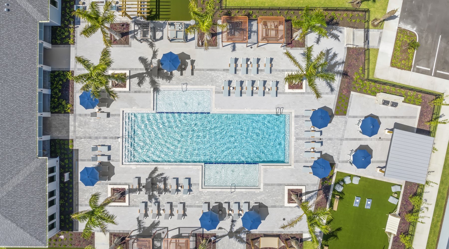 an aerial view of a courtyard with a pool