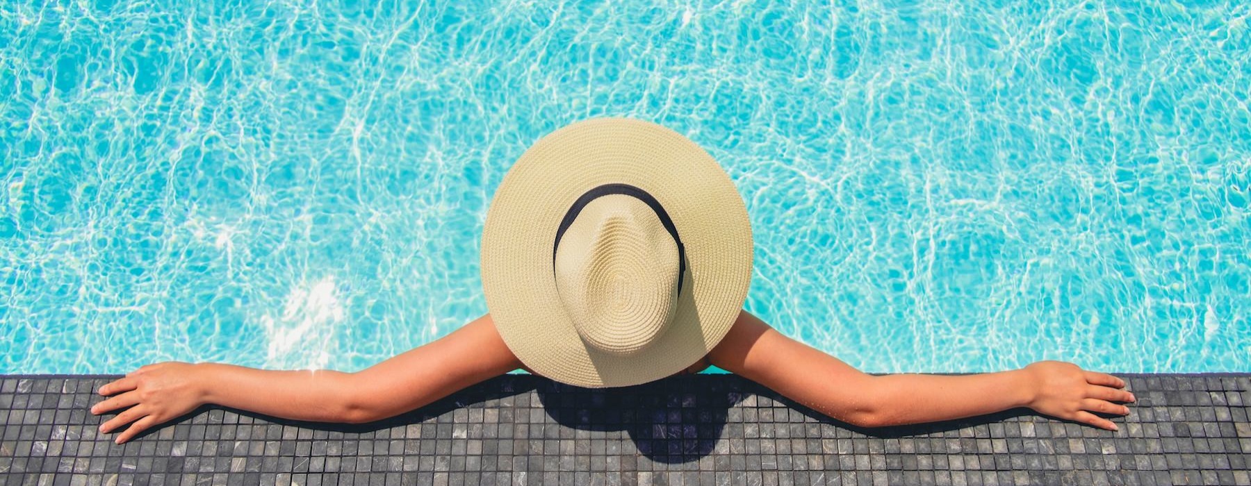 a person lying on the ground with a hat on
