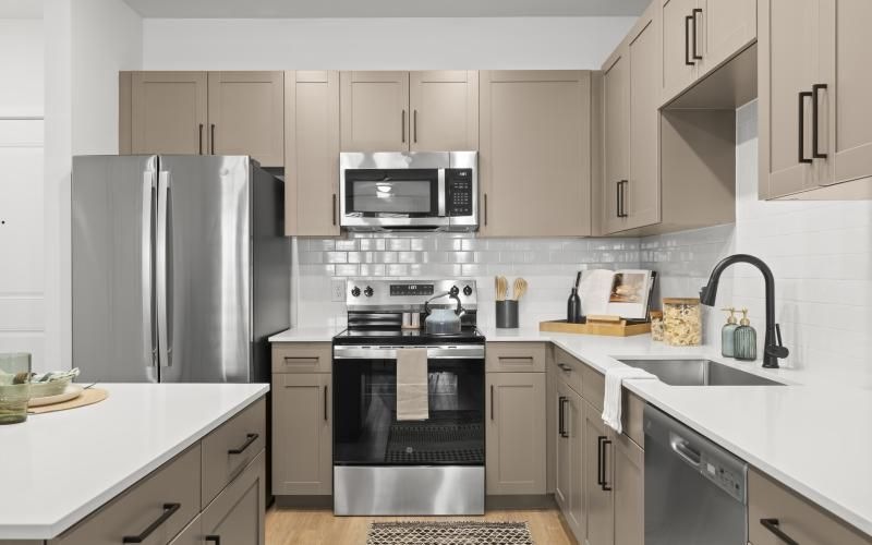 a kitchen with white cabinets